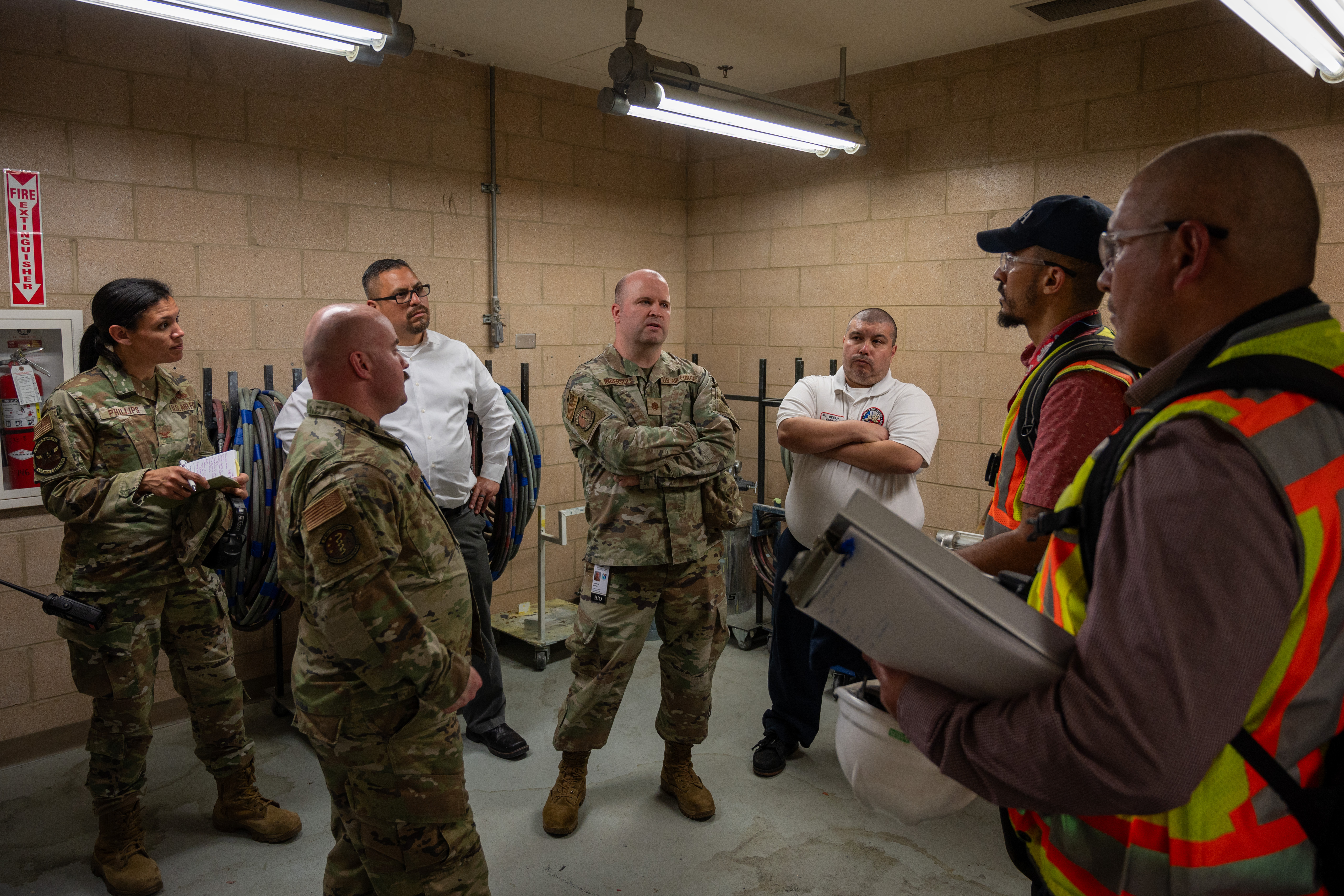 OSHA Inspectors talking with Military members